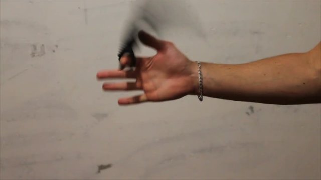 KARAMBIT knife in the hand of a young man