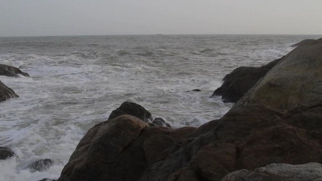 Waves break on the rocky beaches of Muttom in India.