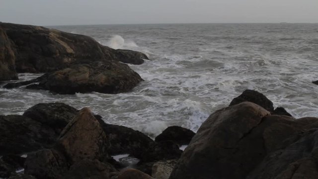 Waves break on the rocky beaches of Muttom in India.