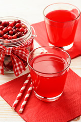 Cranberry kissel in glasses on white table.