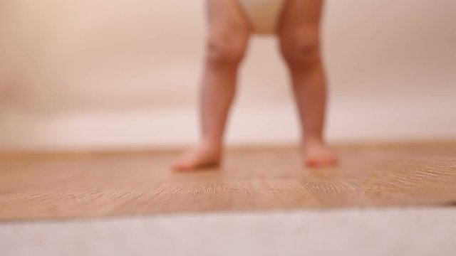 close up of baby feet doing the first steps