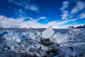 panoramic view of Jokulsarlon Glacier Lagoon with frozen heart at wintertime, iceland