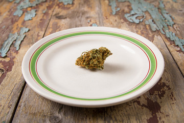 Marijuana buds and joints in the white plate