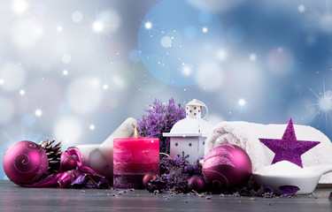 spa massage setting, lavender product, oil and christmas decoration on wooden background, Christmas...