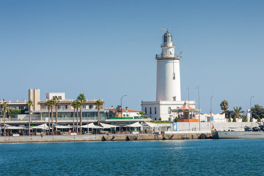 Sea lighthouse at marine of port of Malaga, Andalusia province, Spain.
