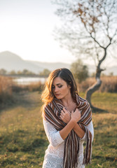 Close-up portrait of beautiful and sad young woman with red hair. Face of girl with freckles.