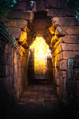 tunnel  golden light in rock castle ancient