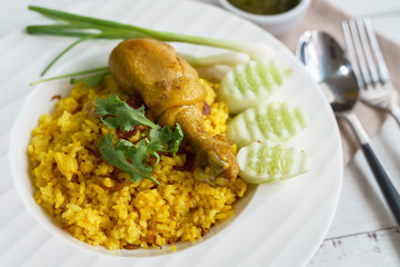 Close up of chicken biryani yellow curry rice