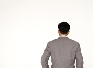 businessmen in darkgray suit from the back looking at something