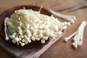 Enoki mushroom on old wooden table