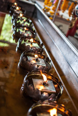 Candle Lighting in ancient temple of Shrine at Muang Samut Sakor