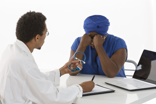 Doctor Treating Female Patient Suffering With Depression