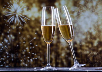 toasting with champagne glasses against holiday lights