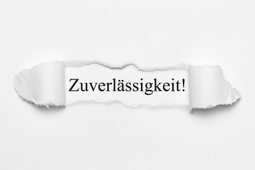 Zuverlässigkeit! auf weißen gerissenen Papier