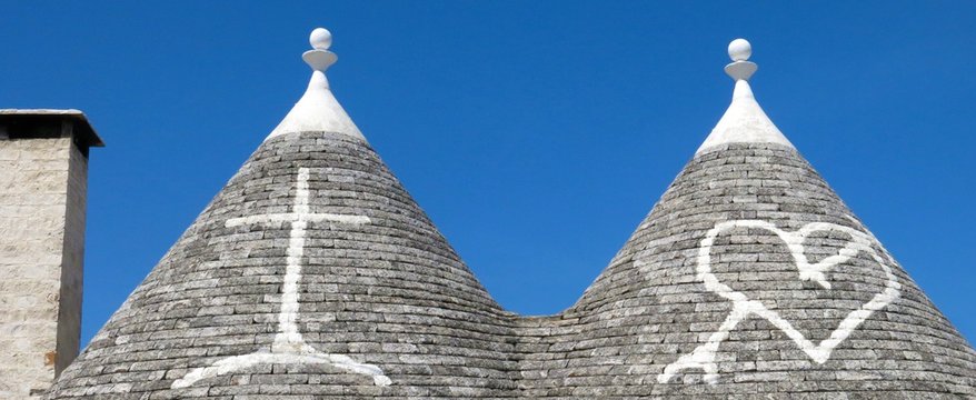 Trulli (plural of trullo) rooftops in Alberobello, Italy. These stone structures with conical rooftops are specific to the Itria Valley in Apulia.