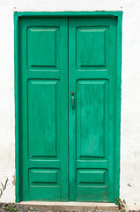 Green wooden door in Betancuria village on Fuerteventura, Canary Islands, Spain