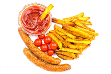 Homemade fast food, portion of french fries, ketchup, grilled sausages and cherry tomato isolated on white background.