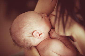 Caring mother breastfeeding
