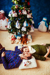 happy young couple lying on the floor