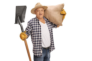 Elderly farmer posing with shovel and burlap sack