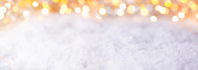 Abstract winter background with snow and golden lights  -  Panorama