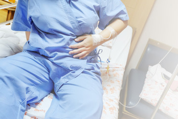 Fototapeta premium Saline intravenous (iv) drip in a women patient hand