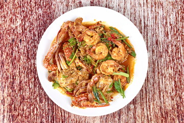 Stir-fried crab and shrimp in curry power is top-ten of popular Thai food as seafood to fried with  fresh milk ,grill curry ,egg ,oyster oil and yellow curry powder. 
