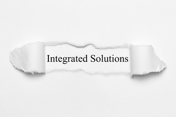 Integrated Solutions on white torn paper