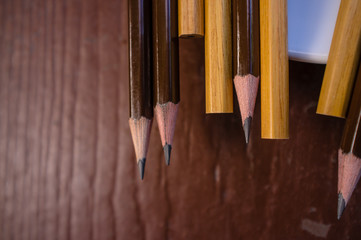 Obraz premium pencil on old wooden background.
