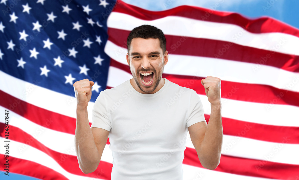 Wall mural angry man showing fists over american flag