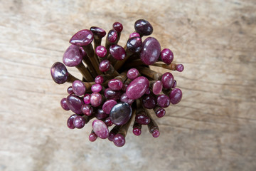 gemstone with wax and dop sticks on old wooden table