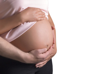 Man and pregnant woman caressing her belly