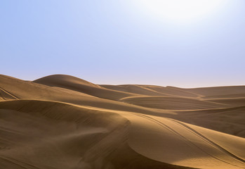 Fototapeta na wymiar Sand dunes against the sky. Arabian sand dune