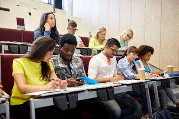 group of students with smartphone at lecture