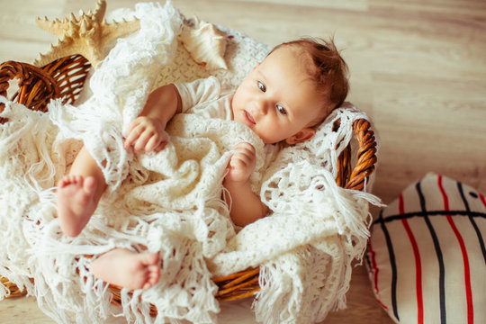 Mother  makes the interesting  photo shoot for a small baby