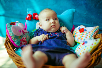 Incredible and charming small baby lying in basket