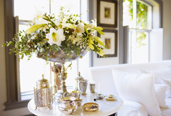 Beautiful flowers in vase on table in room