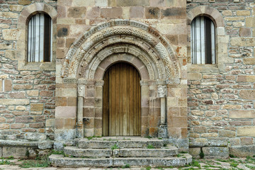 Fototapeta na wymiar front of the Romanesque church of St Martin Bishop in the Salcedillo town in Palencia, Castile and León, Spain