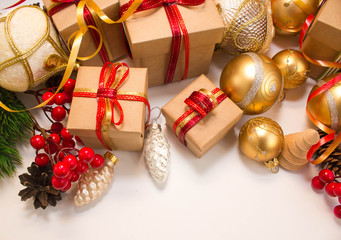 Christmas or New Year background: fur-tree, branches, gifts, colored glass balls, decoration and cones on a white background