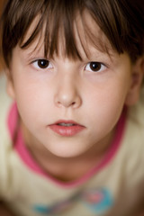 Close up Portrait of calm serious child looking up