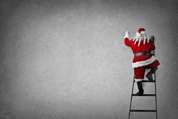 Santa Claus stepping on the stairs - obrazy, fototapety, plakaty