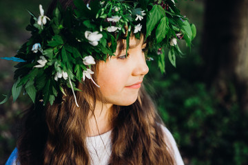 Pretty child girl in a big wreath © pyrozenko13