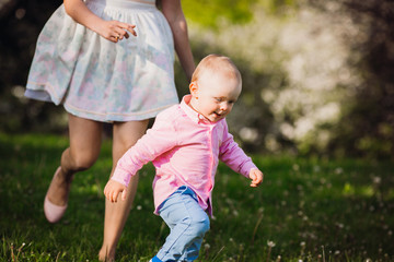 Fototapeta premium Mother runs with a baby