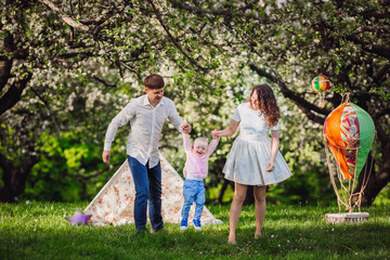 Happy family in the lap of the nature