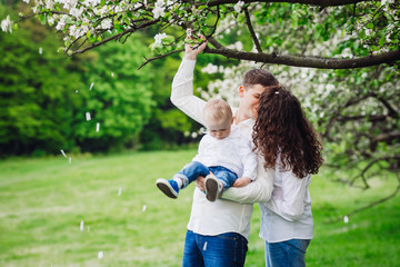 Fototapeta premium Mom, dad and their little boy