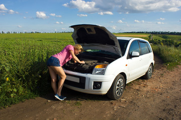 Fototapeta na wymiar Woman reparing car