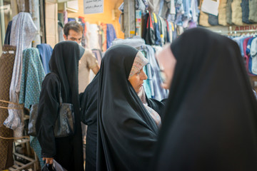 Beautiful Muslim woman spending time on traditional Iranian baza