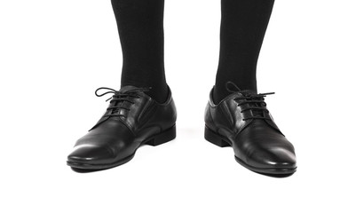men's leg with a black patent-leather shoes
