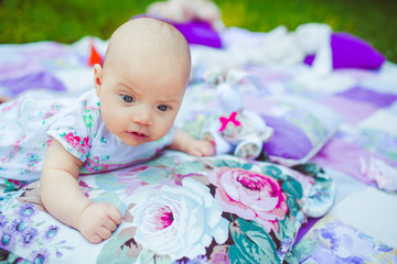Little baby on th colorfull blanket