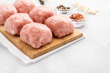 Forcemeat balls on wooden board.Copy space.